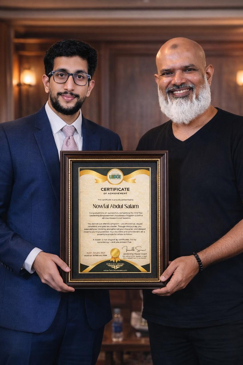 Nowfal Abdul Salam receiving the Leadership Empowerment Accelerator Program (LEAP) certificate from coach Farookh Sensei